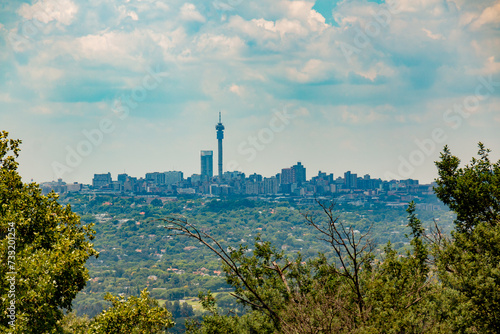 City of Joburg - A skyline of the well known cityscape with a broadcast tower in the centre of the city centre photo