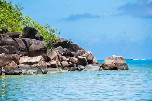 The rocky jungle coast of the Seychelles island of Praslin.