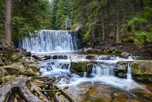 Beautiful waterfall in the middle of the forest in poland town Karpacs