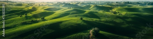 Aerial view of green fields, rolling hills, and rural environment, pure nature, pristine nature scenery, untouched wilderness, website header, copy space. Generative AI ©  DigitalMerchant