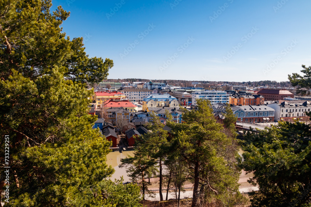 Porvoo, Finland - 10 April 2023: Aerial spring view of Old town of Porvoo, Finland. Beautiful city landscape with old colorful wooden buildings and river Porvoonjoki.