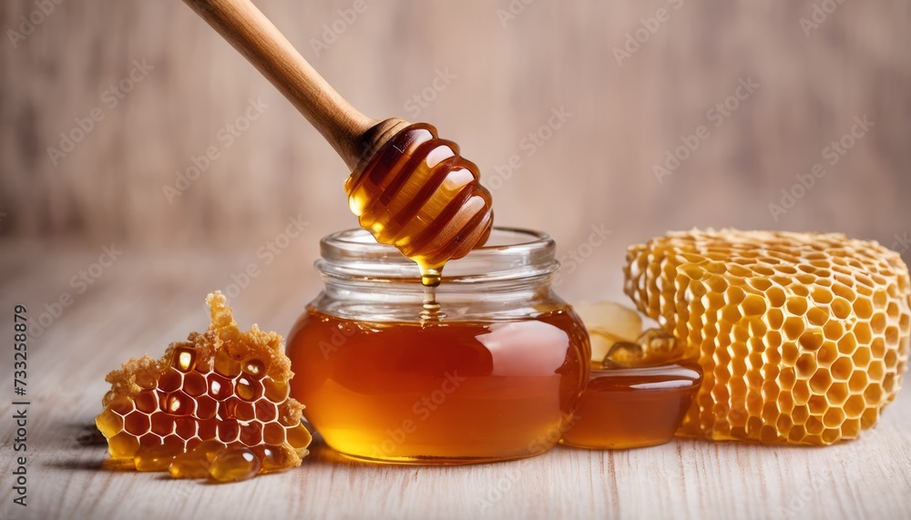 A jar of honey with a wooden spoon in it A jar of honey with a wooden spoon in it