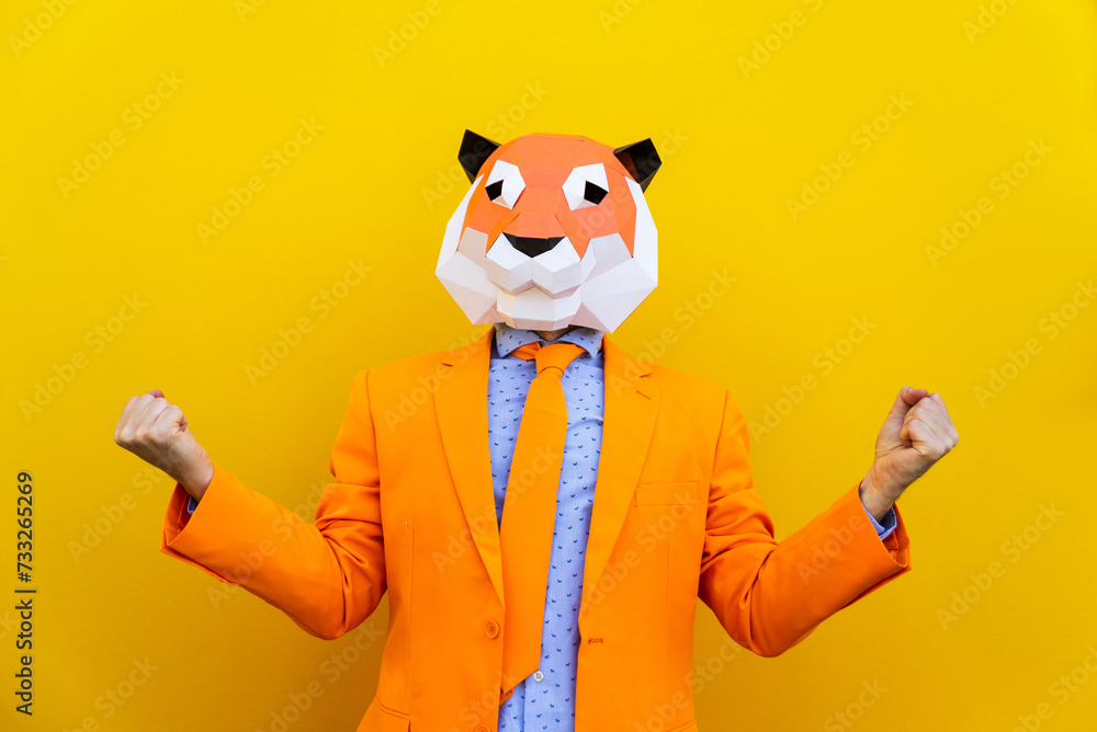 Cool man wearing colorful stylish suit with 3d origami animal funny mask on isolated colored background - obrazy, fototapety, plakaty 