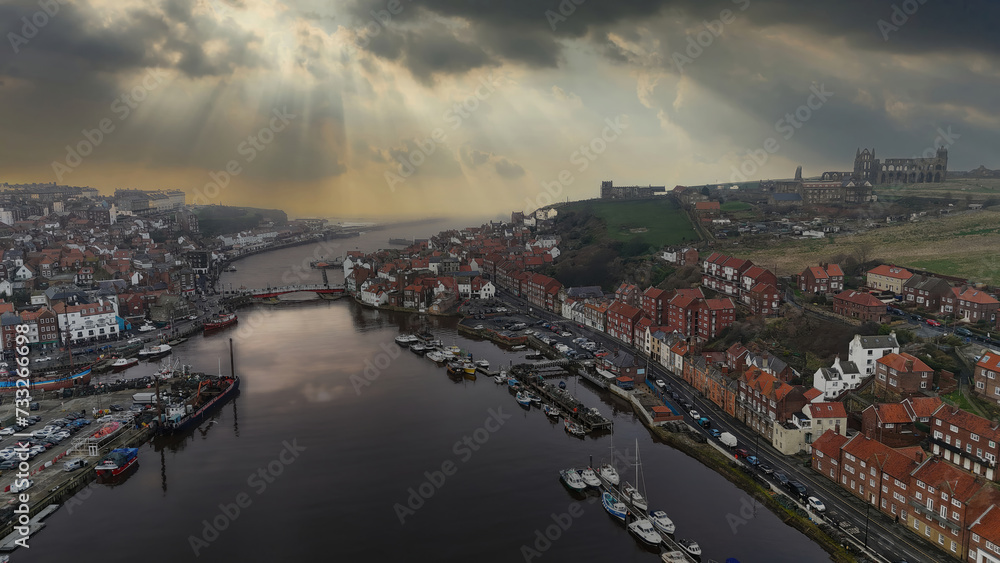 Naklejka premium St Mary the Virgin Church and the old ruined abby in the harbor town of Whitby overlooking the famouse whitby harbor.