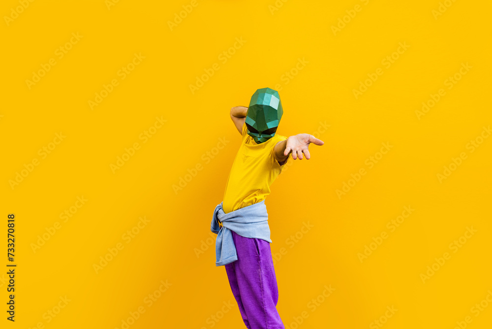 Cool man wearing colorful stylish suit with 3d origami animal funny mask on isolated colored background - obrazy, fototapety, plakaty 