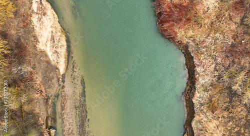 River meander winter floodplain delta Zastudanci drone aerial inland video shot in sandy sand alluvium freezing cold national nature reserve, benches forest and lowlands wetland swamp, view flying fly