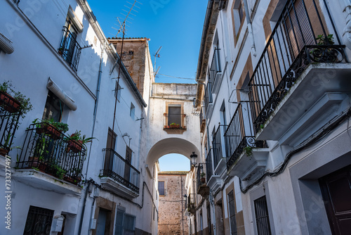 Picturesque streets with grilled balconies and white facades in Caceres, Extremadura. photo
