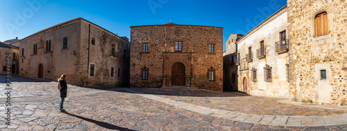 Tourist woman in a large square in Caceres, a World Heritage Site, Spain. photo