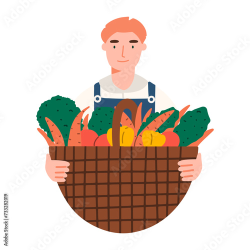 Farmer with a basket of harvested crops. A man holds vegetables from his garden in his hands