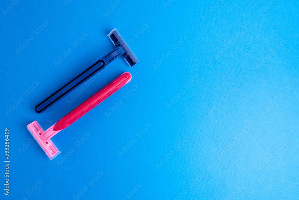 Disposable plastic razor with steel blade, men's and women's razors. Skin and body care concept. Depilation. Place for text Disposable plastic razor with steel blade, men's and women's razors. Skin and body care concept. Depilation. Place for text