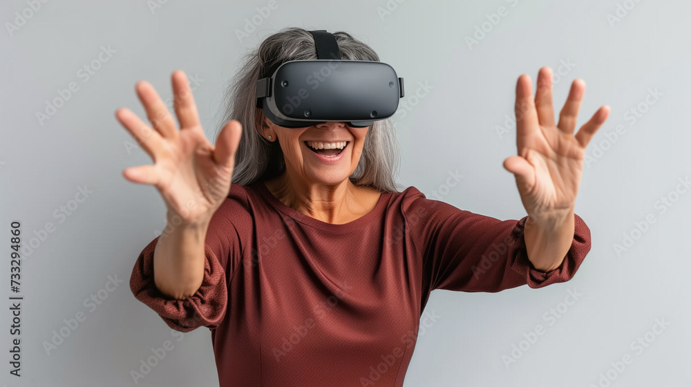 A woman with gray hair explores the world of virtual reality with vr glasses A woman with gray hair explores the world of virtual reality with vr glasses