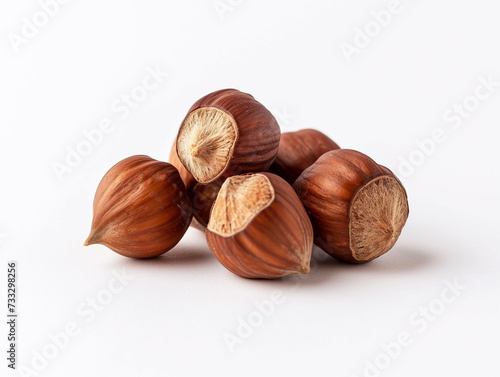 Hazelnuts are isolated on a white background in a minimalist style. Studio photography.