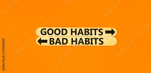 Good or bad habits symbol. Concept word Good habits Bad habits on beautiful wooden stick. Beautiful orange table orange background. Business good or bad habits concept. Copy space.