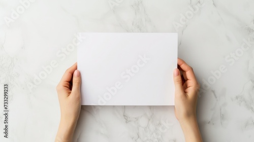 A top-down perspective of a school workspace with hands holdin a blank white paper, mental health and wellness, promoting focus and positivity in education, Workspace setup for learning and creativity