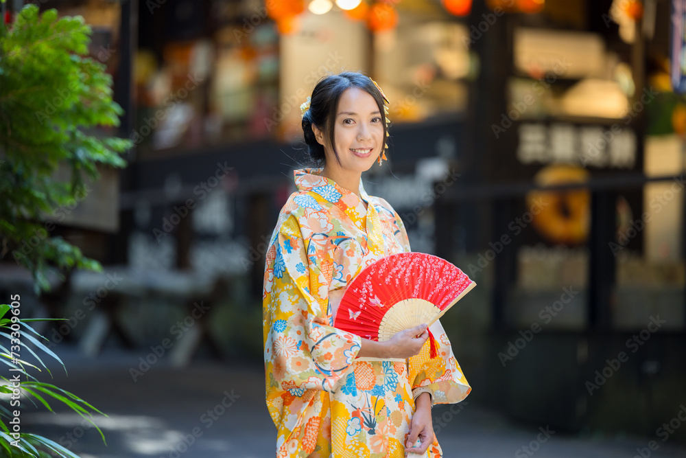 Woman wear Japanese yellow kimono at outdoor
