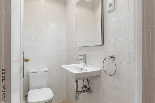 Small White Tiled Bathroom with Modern Fixtures