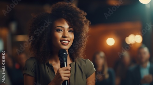 Confident afro-american businesswoman delivering powerful keynote address at conference photo