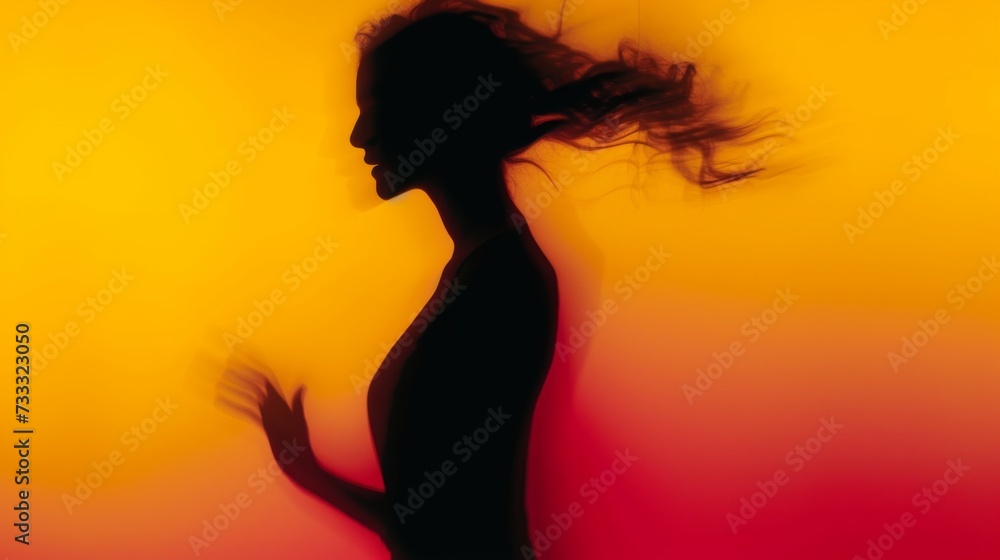 Female blurred silhouette on a orange background. Elegant outline of a woman in motion out of focus Female blurred silhouette on a orange background. Elegant outline of a woman in motion out of focus
