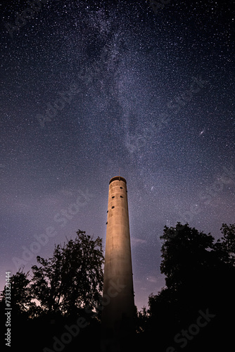 The Milky Way shines in a starry night behind the Mahlberg tower in the northern Black Forest