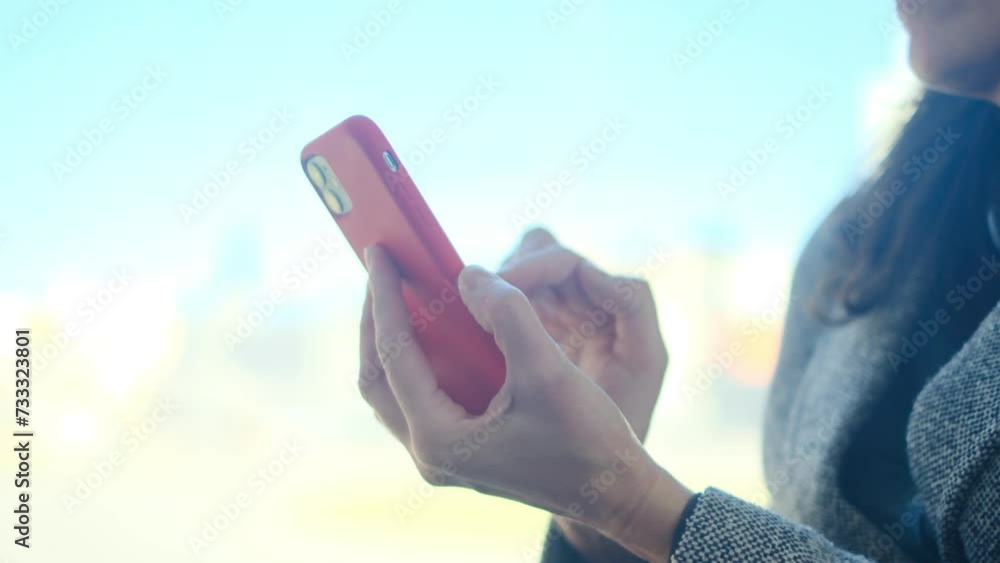 A young woman seated by the window in public transport, whether it be a tram, bus, or subway, is engrossed in checking her emails, browsing social networks, and engaging in phone conversations. A young woman seated by the window in public transport, whether it be a tram, bus, or subway, is engrossed in checking her emails, browsing social networks, and engaging in phone conversations.