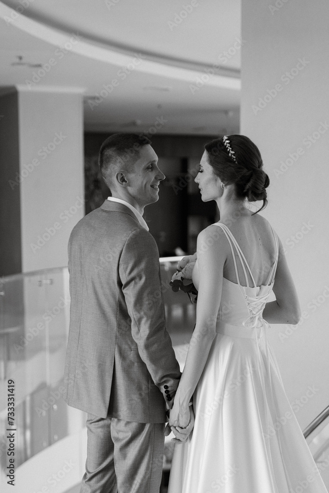 meeting of the bride and groom on the hotel stairs