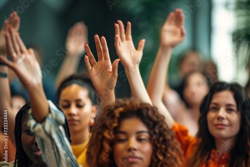 A joyful crowd of women proudly show off their unique styles and personalities as they raise their hands together in solidarity and celebration