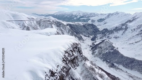 Gudauri, Georgia - December 26, 2021: Aerial view of Russia-Georgia Friendship Monument located on the Georgian Military Highway in the Caucasus.