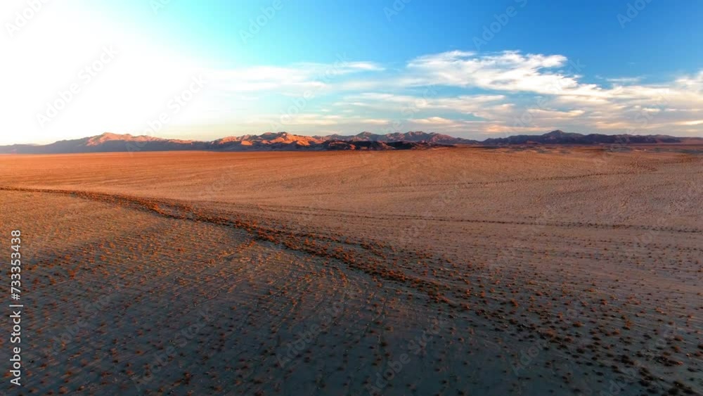 Aerial Backward Idyllic Shot Of Semi Arid Desert Area Under Clouds - Landers, California Aerial Backward Idyllic Shot Of Semi Arid Desert Area Under Clouds - Landers, California