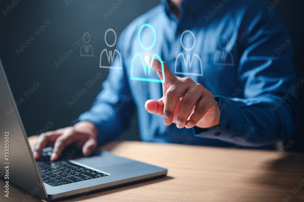 connection, network, social, communication, human, employee, group, recruitment, community, strategy. businessman touching virtual human icon for business management by using social media technology. connection, network, social, communication, human, employee, group, recruitment, community, strategy. businessman touching virtual human icon for business management by using social media technology.