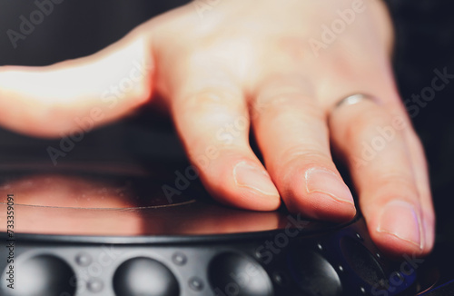 music, technology, people and equipment concept - man using mixing console in sound recording studio. photo