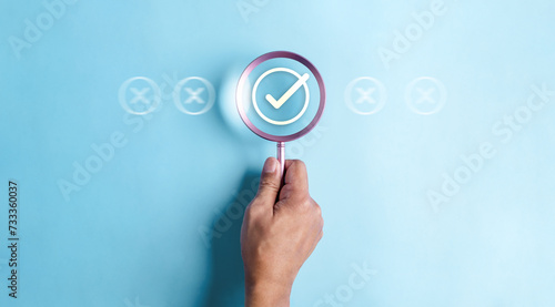 approval, approved, check, checkmark, choice, choose, confirm, correct, cross, decision. use finger to pointing for right or wrong marks on blue background color, the concept of choice without people.