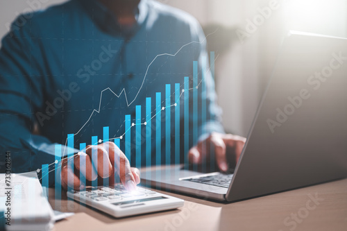 chart, finance, investment, market, stock, analysis, financial, graph, growth, management. businessman typing keyboard to analyze and calculate profitability of working companies with bar graph HUD.