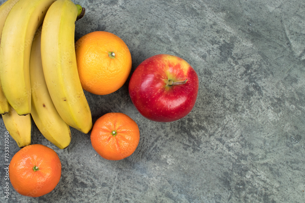 Fruits. Bananas, apples, oranges, tangerines on a biton background. Fruits. Bananas, apples, oranges, tangerines on a biton background.