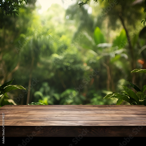 Wooden table with a blur forest background for creative design concept 