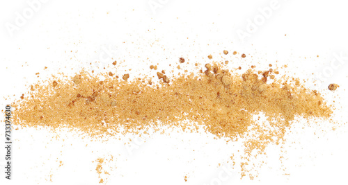 Close up unrefined brown cane sugar, scatter isolated on white, macro 