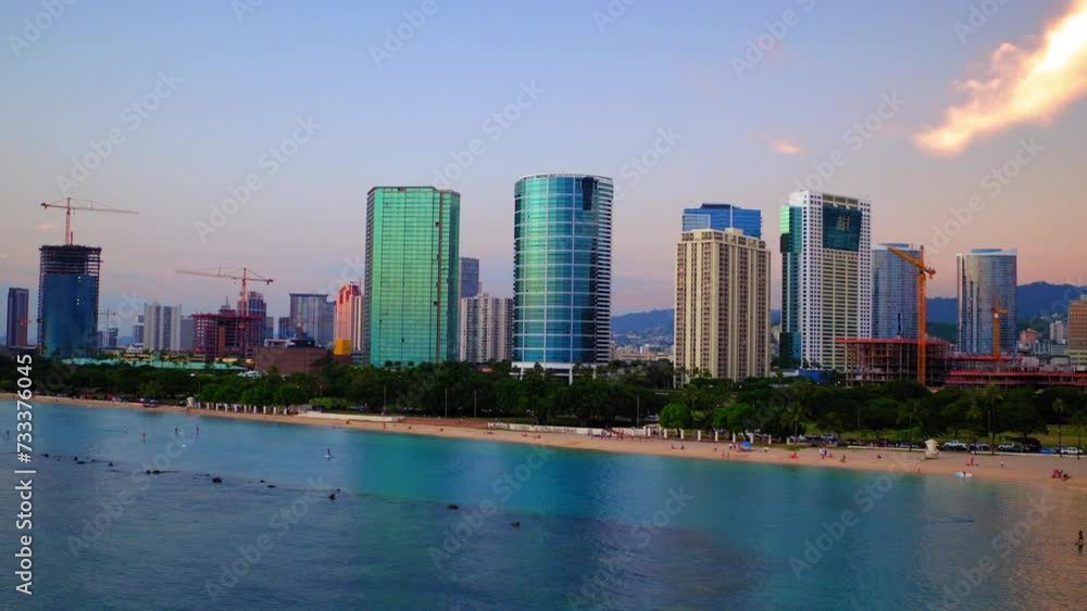 Aerial: Modern Office Buildings In Residential City, Drone Flying Forward Over Sea At Sunset - Honolulu, Hawaii Aerial: Modern Office Buildings In Residential City, Drone Flying Forward Over Sea At Sunset - Honolulu, Hawaii