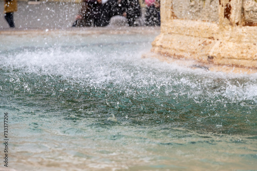 Dynamic Water Spray at Fountain Base Close-Up View