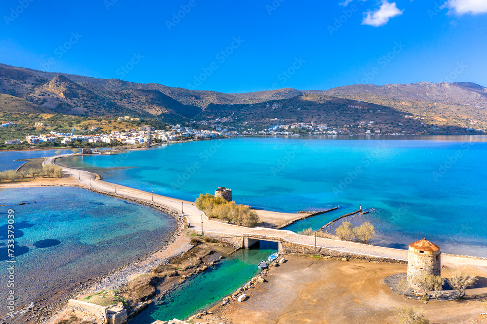 Naklejka premium The famous canal of Elounda with the ruins of the old bridge, Crete, Greece.