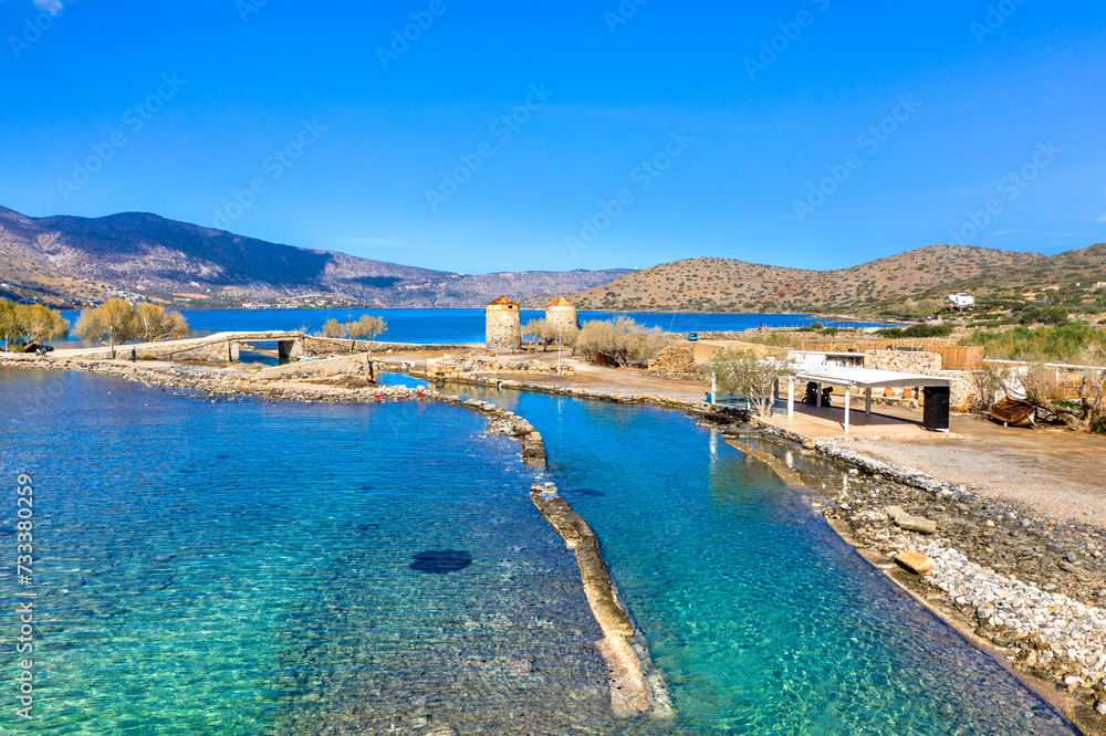 The famous canal of Elounda with the ruins of the old bridge, Crete, Greece.