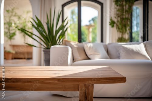 Wooden table and sofa in modern living room, shallow depth of field