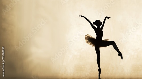  a black and white photo of a ballerina in the middle of a dance pose with her arms in the air and her leg in the air with her arms out.