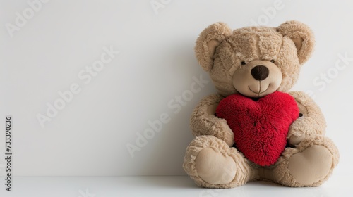 A large plush bear and a heart shaped pillow for Valentines Day