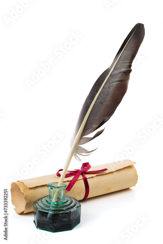 Old scroll or parchment with feather and ink bottle isolated on white background