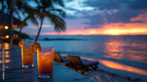 A chic beachfront lounge, with tropical cocktails served against a backdrop o...
