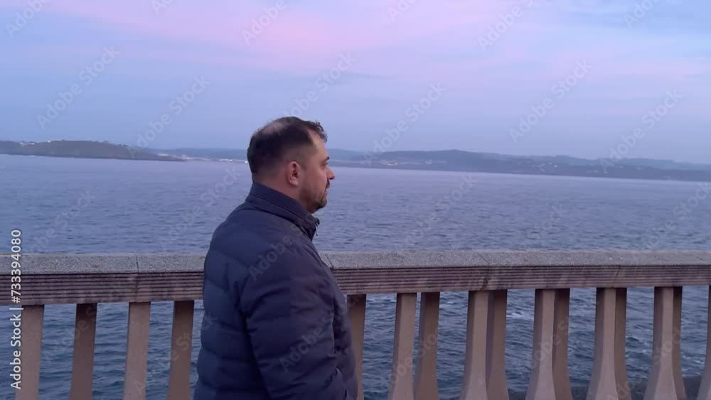 Contemplative Shoreline: A Man's Walk by the Ocean at Dusk Contemplative Shoreline: A Man's Walk by the Ocean at Dusk