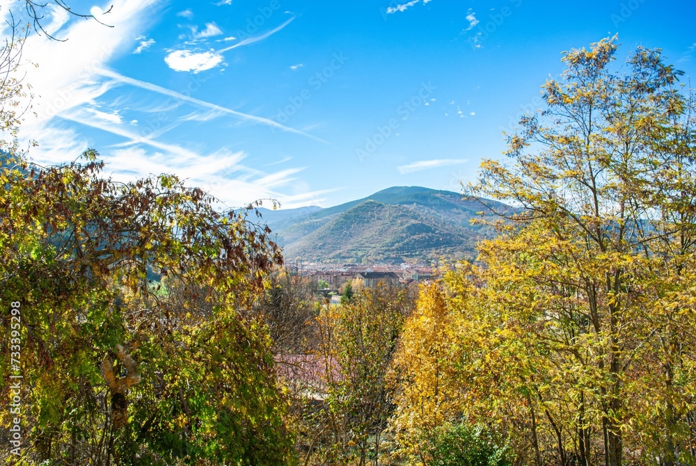 autumn scenery of ezcaray in northern spain, with mountains in the background