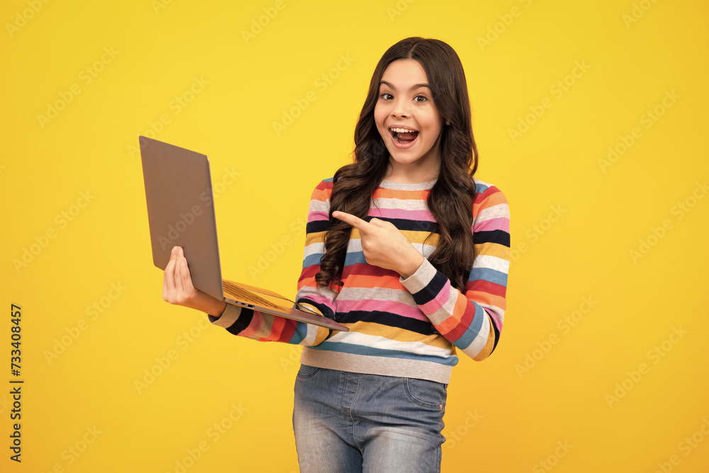 Amazed teenager. Young student school girl, studying with laptop computer. E-learning concept. Excited teen schoolgirl. Amazed teenager. Young student school girl, studying with laptop computer. E-learning concept. Excited teen schoolgirl.