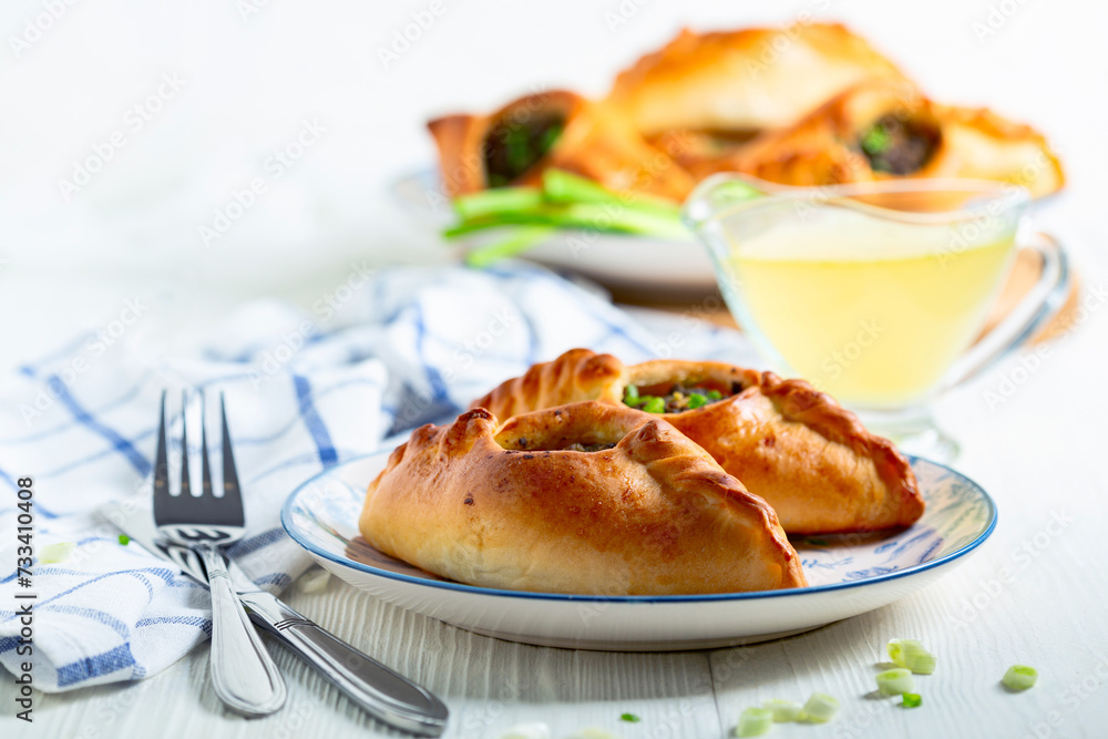 Two open pies with savory filling (rastegay). Russian kitchen. Two open pies with savory filling (rastegay). Russian kitchen.