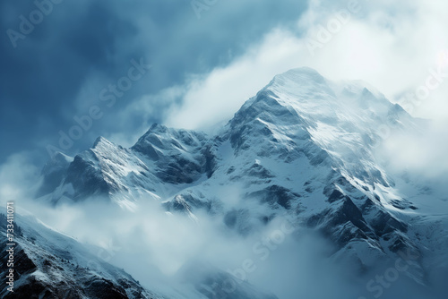 clouds form on snow covered mountains © StockUp