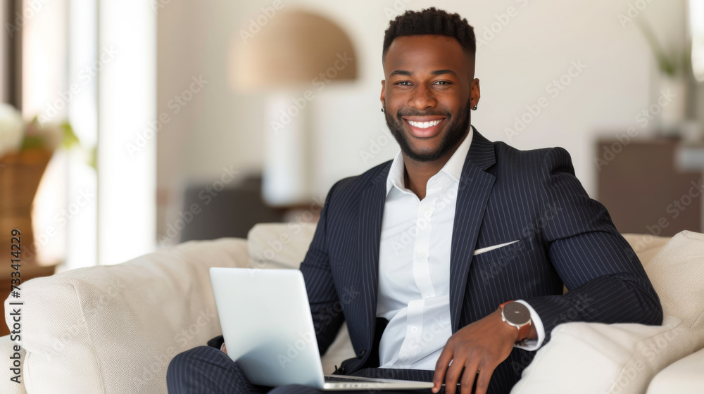 A professional dressed in a business suit is attentively using a laptop while comfortably sitting on a couch, indicating a blend of formal attire with a relaxed remote working environment. A professional dressed in a business suit is attentively using a laptop while comfortably sitting on a couch, indicating a blend of formal attire with a relaxed remote working environment.
